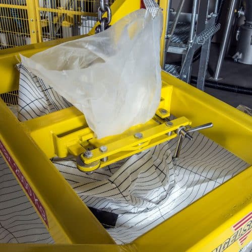 A yellow loading harness with inliner clamp for suspending big bags.